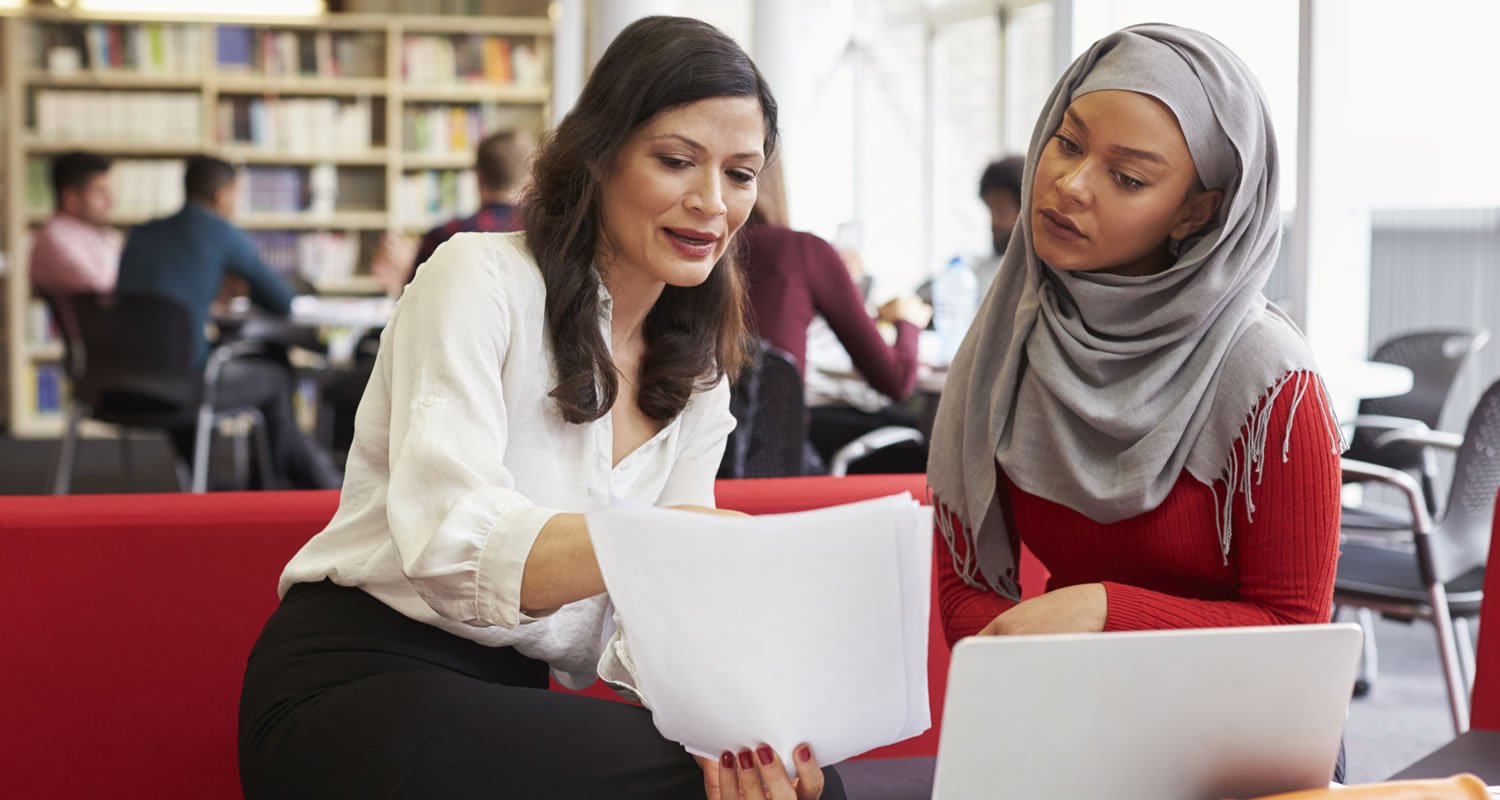 Student listening to careers adviser